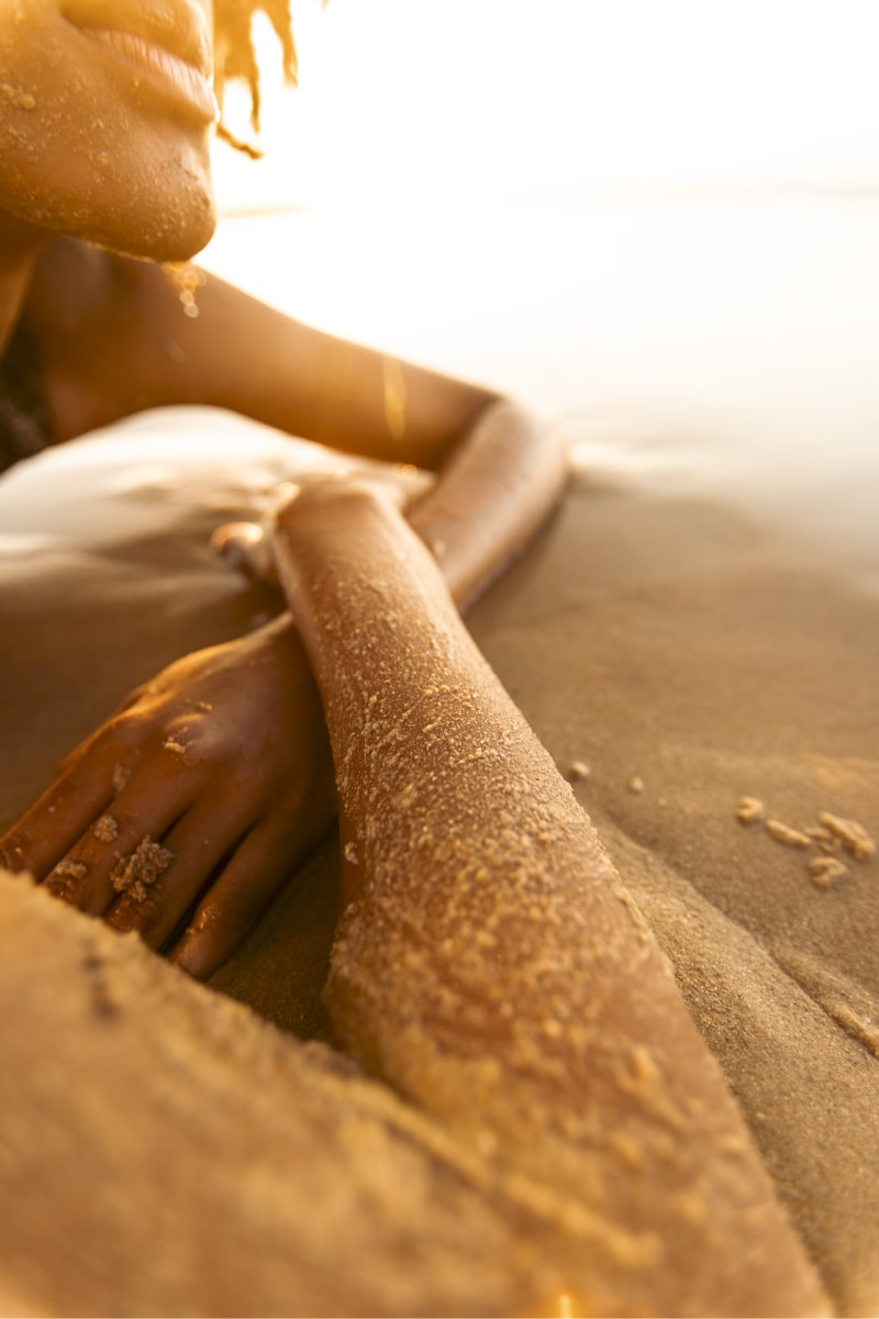 Girl laid down at the beach