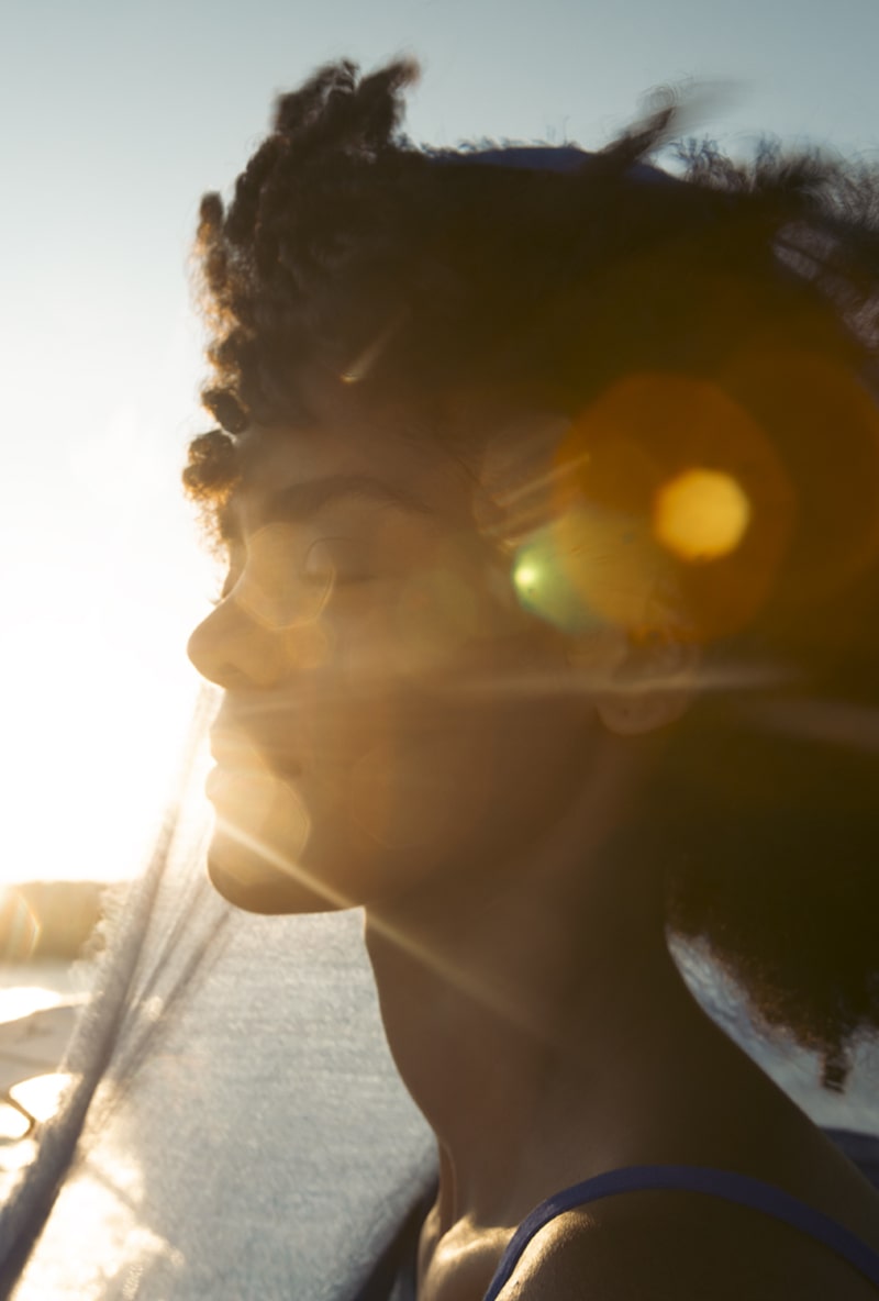 woman breathing fresh air at golden hour