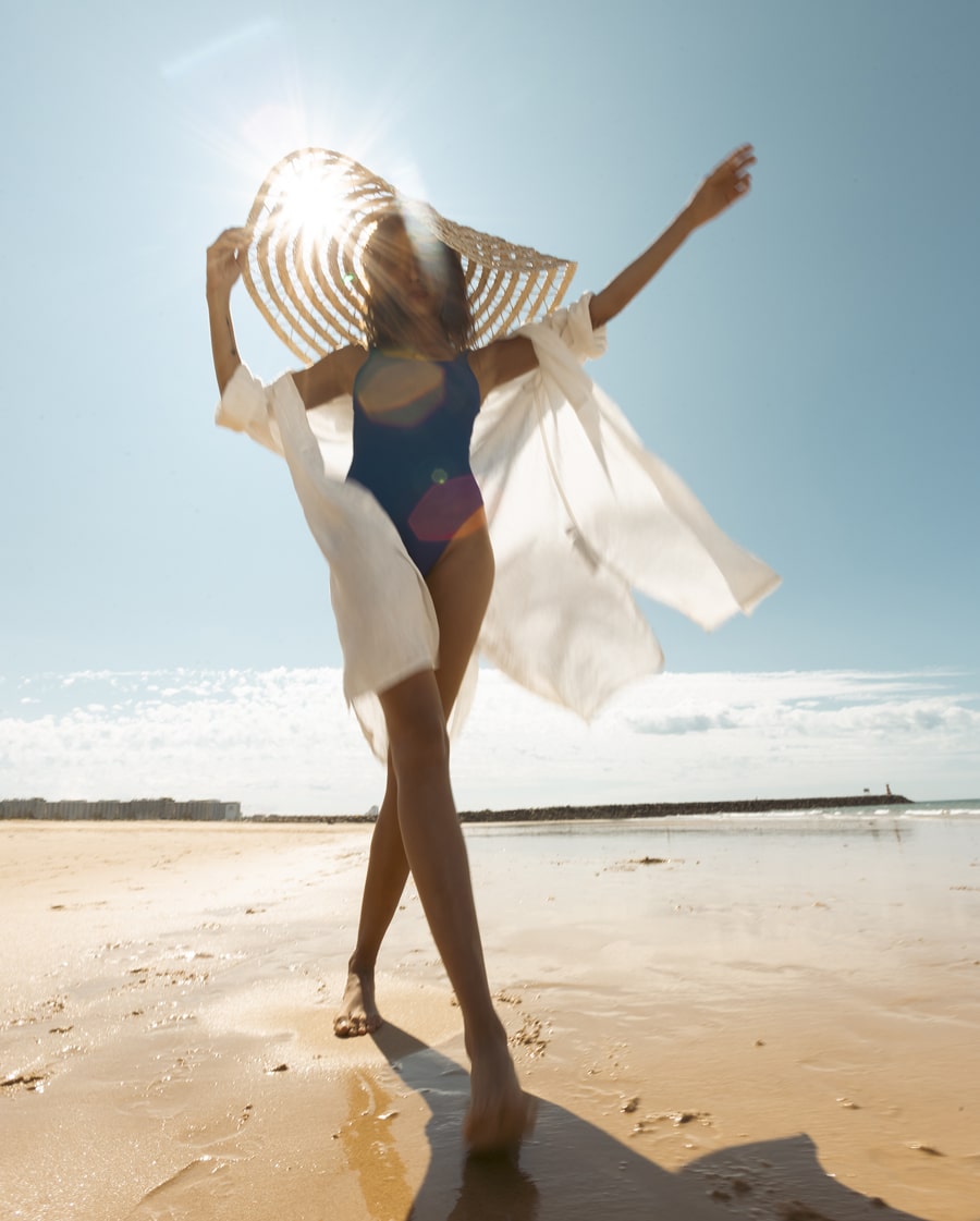 woman waliking on vilamoura beach