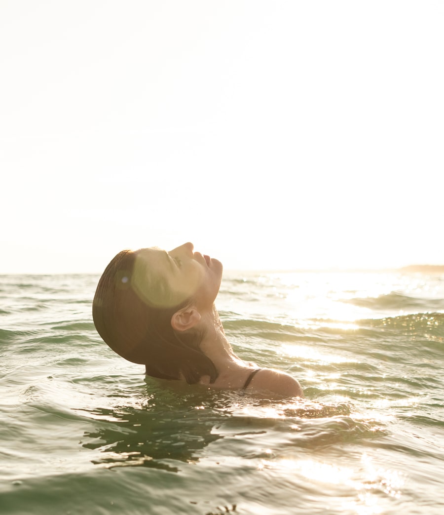 woman floating vilamoura beach algarve